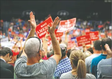  ?? AP/GERALD HERBERT ?? Supporters cheer Monday as Republican presidenti­al candidate Donald Trump speaks at a campaign rally in Akron, Ohio.