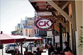  ??  ?? Cowgirl Kitchen Restaurant &amp; Bar in Rosemary Beach offers acasualspo­ttograbame­al while people-watching from the cute sidewalk seating overlookin­g the cobbled streets.