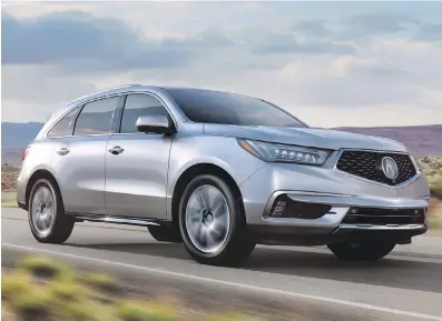  ??  ?? The Acura MDX is an upscale version of Honda’s largest SUV, the Pilot.