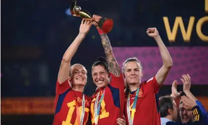  ?? Fife/JIJI PRESS/AFP/Getty Images ?? Jenni Hermoso (centre) celebrates Spain’s World Cup win alongside Alexia Putellas (left) and Irene Paredes (right). Photograph: Franck