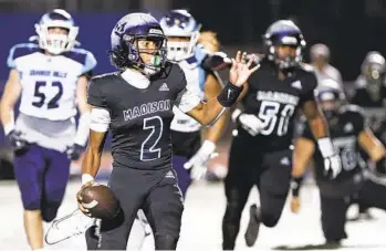  ?? MEG MCLAUGHLIN U-T ?? Madison’s Reggie Johnson (2) looks to pass against Granite Hills in Warhawks’ victory Friday night.