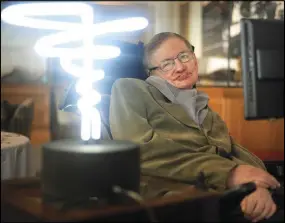  ?? AP PHOTO ?? Professor Stephen Hawking poses beside a lamp titled ‘black hole light’ by inventor Mark Champkins, presented to him during his visit to the Science Museum in London in 2012.