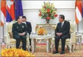  ?? LI XIAOWEI / XINHUA ?? Cambodian Prime Minister Hun Sen (right) meets with State Councilor and Defense Minister Wei Fenghe in Phnom Penh, capital of Cambodia, on Monday.