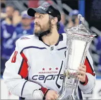  ?? AP PHOTO ?? Washington Capitals left wing Alex Ovechkin holds the Prince of Wales trophy after the Capitals defeated the Tampa Bay Lightning 4-0 during Game 7 of the NHL Eastern Conference finals playoff series Wednesday in Tampa, Fla.