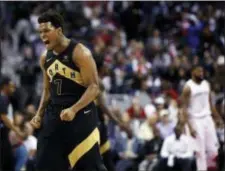  ?? ALEX BRANDON — THE ASSOCIATED PRESS ?? Toronto’s Kyle Lowry celebrates late in the second half of Game 6 of the team’s first-round playoff series against the Wizards on Friday in Washington. The Raptors won, 102-92.