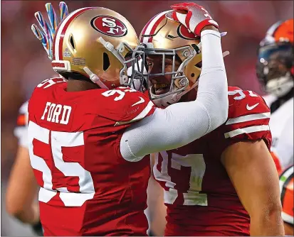  ?? THEARON W. HENDERSON — GETTY IMAGES ?? The 49ers’ Dee Ford, left, and Nick Bosa celebrate after a sack during the second quarter against the Browns at Levi’s Stadium in Santa Clara on Oct 7.