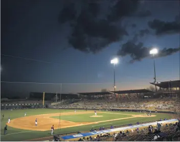  ?? CHRISTIAN PETERSEN — GETTY IMAGES ?? A year ago Thursday, the Dodgers played a spring training game at Camelback Ranch just before sports shut down.