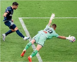  ?? GETTY ?? Bruno Fornaroli gets past Oliver Sail to start Melbourne Victory’s 3-1 comeback win over the Phoenix on February 3.