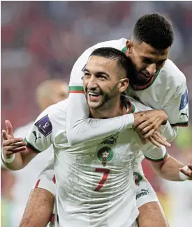  ?? /Reuters ?? World Cup fever: Hakim Ziyech celebrates scoring Morocco’s first goal with teammate Azzedine Ounahi in their 2-1 win over Canada in Doha on Thursday.