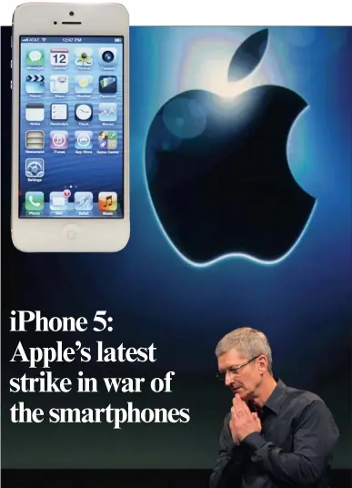  ??  ?? GOING STRONG: Apple CEO Tim Cook launches the new iPhone 5, inset, yesterday. The phone sports a 4-inch “retina” display, can surf a high-speed 4G LTE wireless network, and is 20 percent lighter than the previous iPhone 4S .