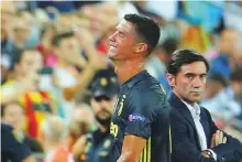  ?? Reuters ?? Juventus’ Cristiano Ronaldo reacts after he is sent off while Valencia coach Marcelino Garcia looks on during a Champions League match in Mestalla, Valencia.