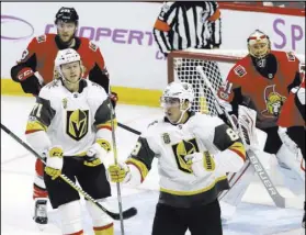  ?? Fred Chartrand The Canadian Press via AP ?? Golden Knights right wing Alex Tuch, bottom right, celebrates his goal in front of teammate William Karlsson and Senators goalie Craig Anderson and defenseman Fredrik Claesson on Saturday.