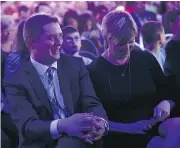  ?? COLE BURSTON / BLOOMBERG ?? Andrew Scheer sits with his wife Jill during the Conservati­ve Leadership Conference in Toronto last Saturday. One of the Tory candidates’ campaigns leaked a membership list to a gun lobby group.