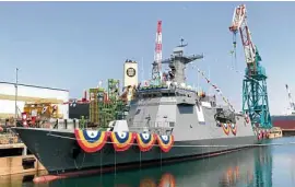  ?? —FRANCES MANGOSING ?? IN THE WATER AT LAST Bunting bedeck the BRP Jose Rizal, the first brand-new warship of the Philippine Navy, which was launched on Thursday by Hyundai Heavy Industries at its shipyard in Ulsan, South Korea. The 107-meter missile-armed frigate is capable of antisurfac­e, antisubmar­ine and electronic warfare.