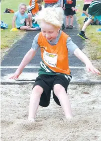  ??  ?? Under six athlete Archie Hammond recorded an impressive distance of 1.65 metres in the long jump.