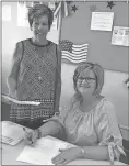  ?? Contribute­d photo ?? Elections Director Karen Garmon stands with board of education candidate Judy Wiggins as she qualifies to keep her seat after being appointed in the interim to fill the District 6 spot.
