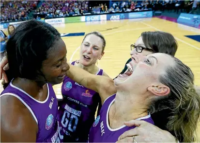  ?? PHOTOS: GETTY IMAGES ?? Romelda Aitken and Laura Geitz celebrate after the Firebirds scraped to a 69-67 victory in the Trans-Tasman Netball League final.