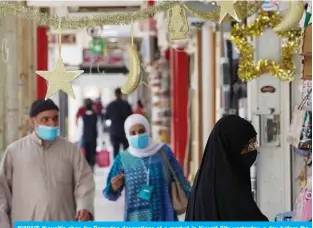  ??  ?? KUWAIT: Kuwaitis shop for Ramadan decoration­s at a market in Kuwait City yesterday, a day before the start of the holy month of Ramadan. — Photo by Yasser Al-Zayyat