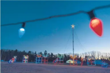  ?? ROBERT F. BUKATY/AP ?? Holiday lights on display this month on a drive-thru route at the Cumberland Fair Grounds in Cumberland, Maine.