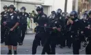  ?? Photograph: Ringo HW Chiu/AP ?? Los Angeles police officers fire rubber bullets during a protest on 30 May 2020.