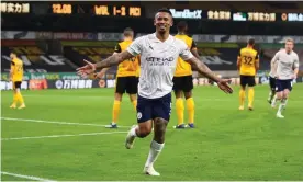  ??  ?? Gabriel Jesus celebrates after scoring Manchester City’s third goal in injury time to see off Wolves at Molineux. Photograph: Marc Atkins/Getty Images