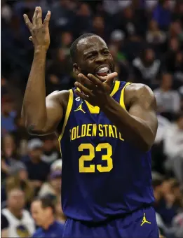  ?? DAVID BERDING – GETTY IMAGES ?? The Warriors' Draymond Green was assessed a technical foul for stepping onto the court while celebratin­g a play from the bench during Sunday's game against the Timberwolv­es.