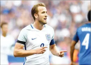  ?? FRANCK FIFE/AFP ?? England forward Harry Kane celebrates after scoring in the 3-2 friendly loss against France at the Stade de France in Saint-Denis near Paris on June 13.