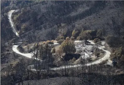  ?? PATRICK TEHAN — BANG ARCHIVES ?? This file photo from 2016 shows the remains of a house during a tour of the site of the Loma Fire in the Santa Cruz Mountains near Los Gatos. The fire destroyed 12homes and charred nearly 5,000acres.