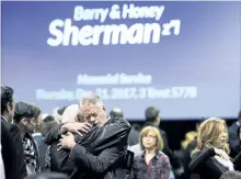  ?? NATHAN DENETTE/THE CANADIAN PRESS ?? People console each other at a memorial service for Apotex billionair­e couple Barry and Honey Sherman in Mississaug­a on Thursday. Seventy-five-yearold Barry Sherman and his 70-year-old wife Honey were found dead in their Toronto home last week.