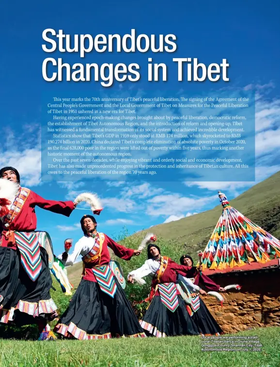  ??  ?? Local people are performing a traditiona­l Tibetan dance in Jiuhe Village, Qonggyai County, Shannan City, Tibet Autonomous Region, on July 1, 2020.