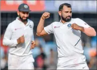  ?? (AFP) ?? India’s Mohammed Shami (right) celebrates the dismissal of Bangladesh’s Taijul Islam on the third day of their first Test at the Holkar Cricket Stadium in Indore on Saturday.