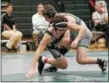  ?? SHARON HOLY PHOTOGRAPH­Y ?? Luke McKeon of the Lake Catholic wrestling team, right, works for a takedown at the recent Jimmy Cook/Steve Galeazzo Duals.