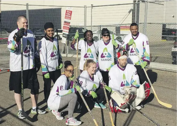  ?? DUSTIN COOK ?? NorQuest College’s road hockey team — featuring people from around the world — does a little bonding on Friday.