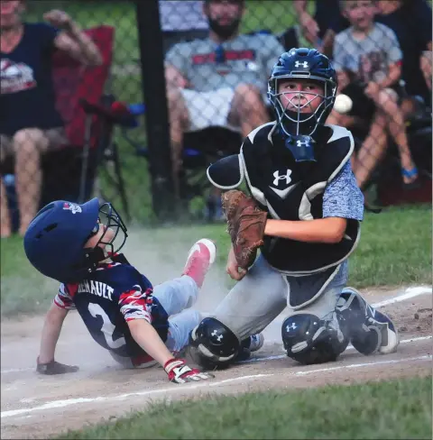  ?? Photos by Ernest A. Brown ?? Lincoln Little League Jimmy Fund all-star Austin Henault (2) successful­ly slides into home plate in the second inning of Lincoln’s 8-2 victory over Cumberland at Lajoie Field to claim the Jimmy Fund title. Lincoln pitcher Evan Cucca threw a 56-pitch...