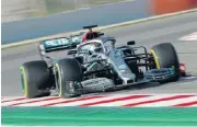  ??  ?? Valtteri Bottas tries out the new 2020 Mercedes car fitted with a novel dual-axis steering system.