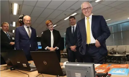  ?? Photograph: Mike Bowers for the Guardian ?? Prime minister Malcolm Turnbull, cyber security minister Angus Taylor and defence minister Marise Payne at the opening of the Australian Cyber Security Centre in Canberra on Thursday.
