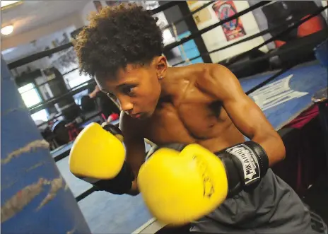  ?? Photo by Ernest A. Brown ?? A student at Goff Junior High in Pawtucket, Nasaiah “Bubba” Shelton returned to the ring less than two months after getting struck by a car in June. In addition to boxing, Shelton also plays football and runs track.