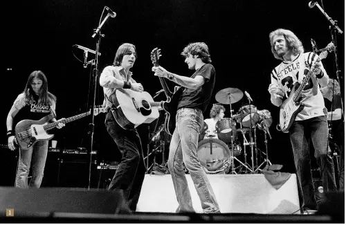  ??  ?? The Eagles welcome Browne on stage as a special guest at the Chicago Stadium, 1979. Pictured (left to right) are: Timothy B Schmit, Jackson Browne, Glenn Frey, Don Henley (behind drums), Don Felder and Joe Walsh