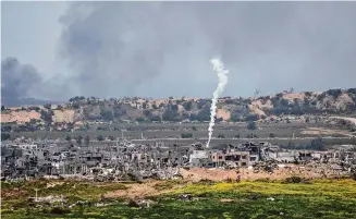  ?? Ohad Zwigenberg/Associated Press ?? An Israeli army flare is seen over the Gaza Strip, as seen from southern Israel, Monday.