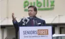  ?? Photograph: Bob Self/AP ?? Publix donated donated $100,000 to a political action committee looking to secure Ron DeSantis’s re-election in 2022. Soon after, the governor awarded Publix a lucrative and exclusive contract to distribute Covid-19 vaccines in numerous stores.