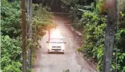  ?? (AFP) ?? An ambulance leaves the Tham Luang cave area as divers evacuated some of the 12 boys and their coach trapped at the cave in Khun Nam Nang Non Forest Park in the Mae Sai district of Chiang Rai province on July 8, 2018.