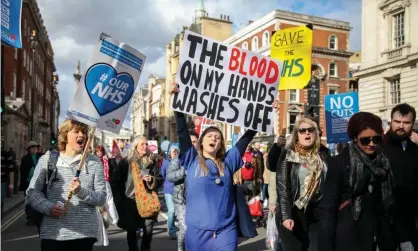  ??  ?? NHS workers and members of the public march against the Tory government’s programme of cuts to the health service in 2017. Photograph: Alamy Stock Photo