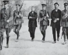  ??  ?? Thomas Kent and his brother, William, being marched over Fermoy Bridge following their arrest by Crown forces in 1916.
