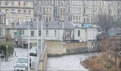  ??  ?? REAR VIEW: The building at Canonmills bridge by the Water of Leith where apartments are planned. Picture: Gordon Terris