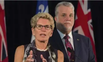  ?? JACQUES BOISSINOT/THE CANADIAN PRESS ?? Ontario Premier Kathleen Wynne and her Quebec counterpar­t, Philippe Couillard, both oppose the NDP’s plan to abolish the Senate without consent of the provinces.