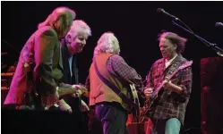  ?? — AFP photos ?? In this file photo Stephen Stills (left), Graham Nash (second left), David Crosby (second right) and Neil Young (right) perform live for the first time since 1974 at the Palace of Auburn Hill, Michigan.