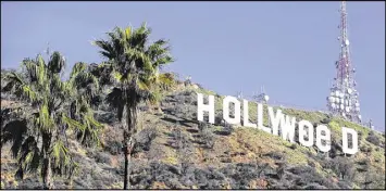  ?? DAMIAN DOVARGANES / AP ?? Los Angeles residents awoke New Year’s Day to find a prankster had altered the famed Hollywood sign to read “HOLLYWeeD.” California voters in November approved Propositio­n 64, which legalized the recreation­al use of marijuana.