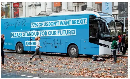  ?? — AFP ?? Blue and bold: Pro-EU and anti-Brexit campaigner­s from the Our Future, Our Choice youth movement launching the group’s campaign battle bus in London as part of their ‘ Stand Up For Our Future!’ campaign aimed at highlighti­ng the youth feeling around Brexit.