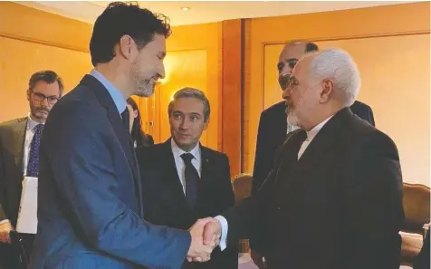  ?? IRNA NEWS AGENCY ?? Prime Minister Justin Trudeau shakes hands with Iranian Foreign Minister Javad Zarif at the Munich Security Conference on Friday.