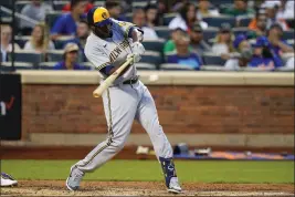  ?? FRANK FRANKLIN II — THE ASSOCIATED PRESS ?? The Milwaukee Brewers' Lorenzo Cain hits a single during the fourth inning Wednesday against the New York Mets in New York. Cain was designated for assignment Saturday by the Brewers.
